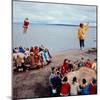Native Alaskans Playing a Game of Nulukatuk, in Which Individals are Tossed into the Air-Ralph Crane-Mounted Photographic Print