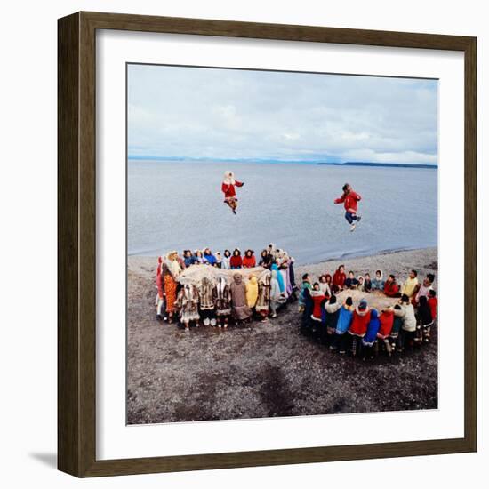 Native Alaskans Playing a Game of Nulukatuk, in Which Individals are Tossed into the Air-Ralph Crane-Framed Photographic Print