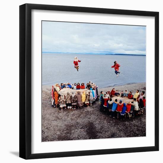 Native Alaskans Playing a Game of Nulukatuk, in Which Individals are Tossed into the Air-Ralph Crane-Framed Photographic Print