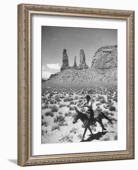 Native American Indian Boy Running His Horse Through Desert-Loomis Dean-Framed Photographic Print