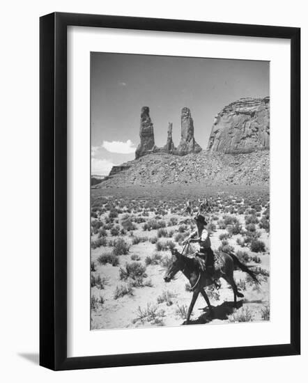 Native American Indian Boy Running His Horse Through Desert-Loomis Dean-Framed Photographic Print