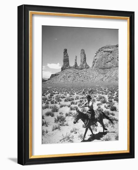 Native American Indian Boy Running His Horse Through Desert-Loomis Dean-Framed Photographic Print