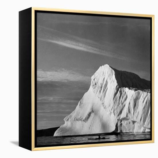 Native Man in Kayak Sitting in Water Next to Iceberg-null-Framed Premier Image Canvas