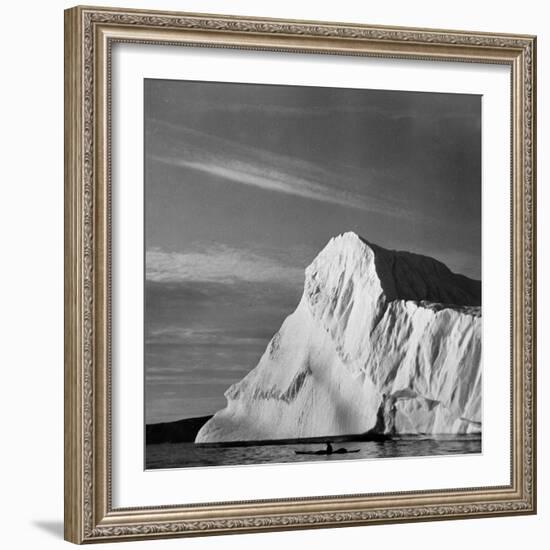 Native Man in Kayak Sitting in Water Next to Iceberg-null-Framed Photographic Print