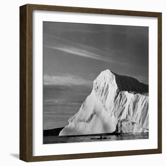 Native Man in Kayak Sitting in Water Next to Iceberg-null-Framed Photographic Print