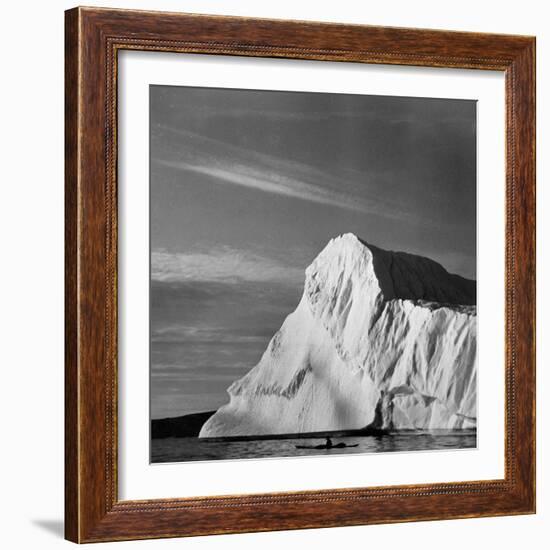 Native Man in Kayak Sitting in Water Next to Iceberg-null-Framed Photographic Print