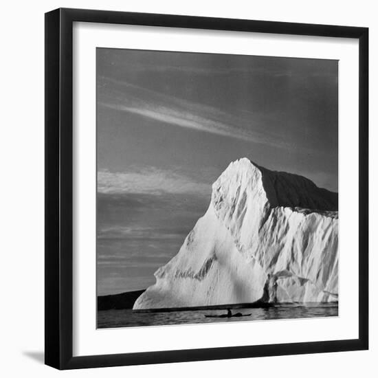 Native Man in Kayak Sitting in Water Next to Iceberg-null-Framed Photographic Print