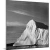 Native Man in Kayak Sitting in Water Next to Iceberg-null-Mounted Photographic Print