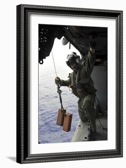 Naval Aircrewman Conducts a Search and Rescue Drill on an Mh-60S Sea Hawk-null-Framed Photographic Print