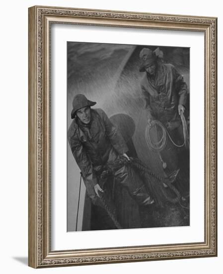 Naval Officers Working on a Ship During a Storm-George Strock-Framed Photographic Print