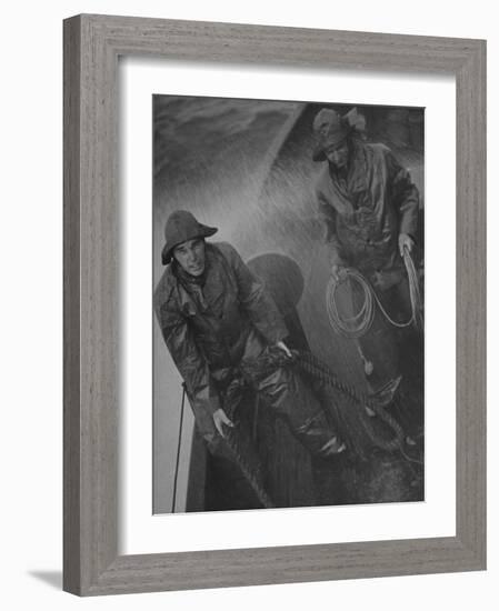 Naval Officers Working on a Ship During a Storm-George Strock-Framed Photographic Print