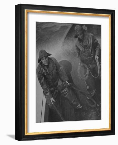 Naval Officers Working on a Ship During a Storm-George Strock-Framed Photographic Print