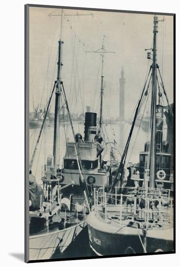'Naval Trawler, HMS Liffy alongside a Grimsby fishing vessel in Grimsby Docks', 1937-Unknown-Mounted Photographic Print