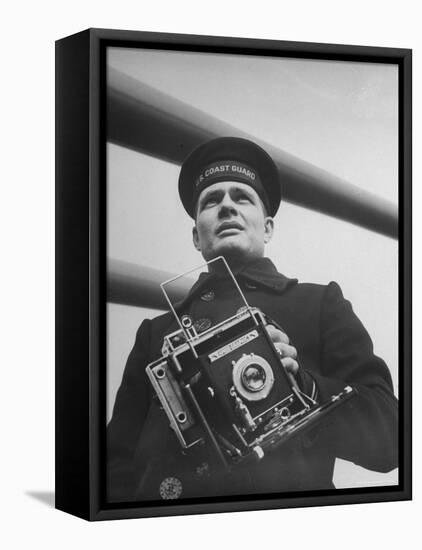 Navy Soldier Holding Camera-George Strock-Framed Premier Image Canvas