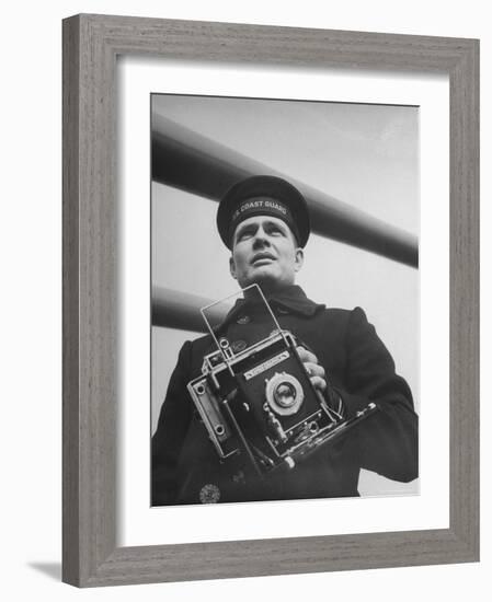 Navy Soldier Holding Camera-George Strock-Framed Photographic Print