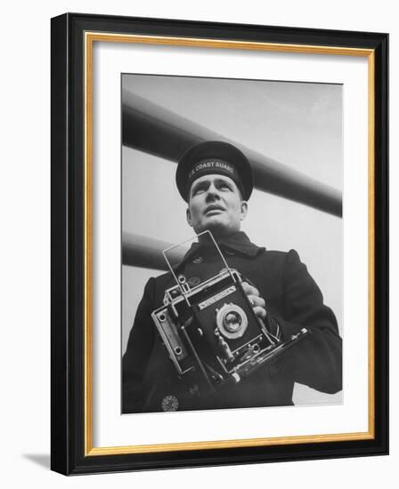 Navy Soldier Holding Camera-George Strock-Framed Photographic Print