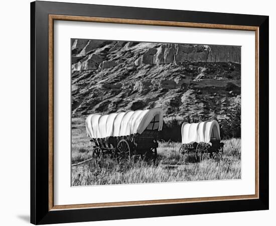 Nebraska, Scotts Bluff National Monument. Covered Wagons in Field-Dennis Flaherty-Framed Photographic Print