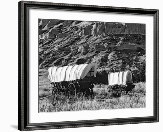 Nebraska, Scotts Bluff National Monument. Covered Wagons in Field-Dennis Flaherty-Framed Photographic Print