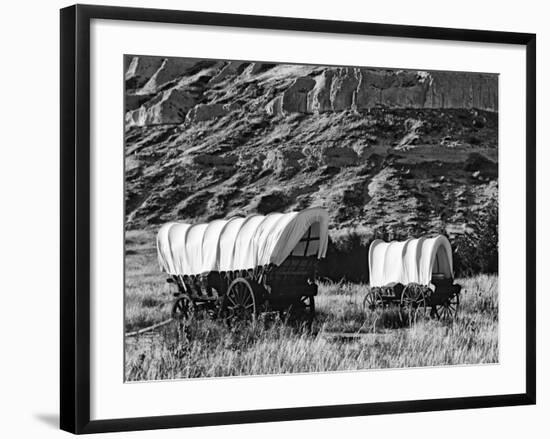 Nebraska, Scotts Bluff National Monument. Covered Wagons in Field-Dennis Flaherty-Framed Photographic Print