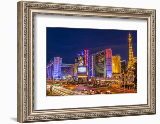 Neon Lights on Las Vegas Strip at Dusk with Car Headlights Leaving Streaks of Light-Eleanor Scriven-Framed Photographic Print