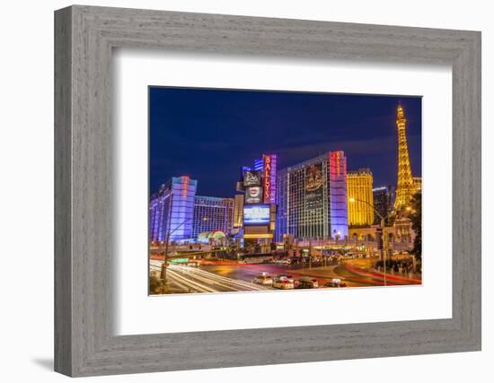 Neon Lights on Las Vegas Strip at Dusk with Car Headlights Leaving Streaks of Light-Eleanor Scriven-Framed Photographic Print