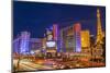 Neon Lights on Las Vegas Strip at Dusk with Car Headlights Leaving Streaks of Light-Eleanor Scriven-Mounted Photographic Print