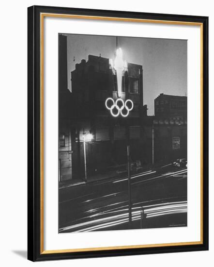 Neon Olympic Symbol in Melbourne-John Dominis-Framed Photographic Print