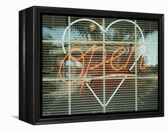 Neon 'Open' sign framed in a heart-shape in a window-null-Framed Premier Image Canvas