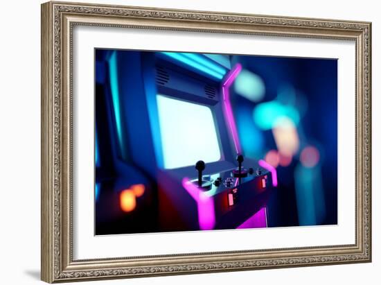 Neon Retro Arcade Machines In A Games Room-James Thew-Framed Art Print