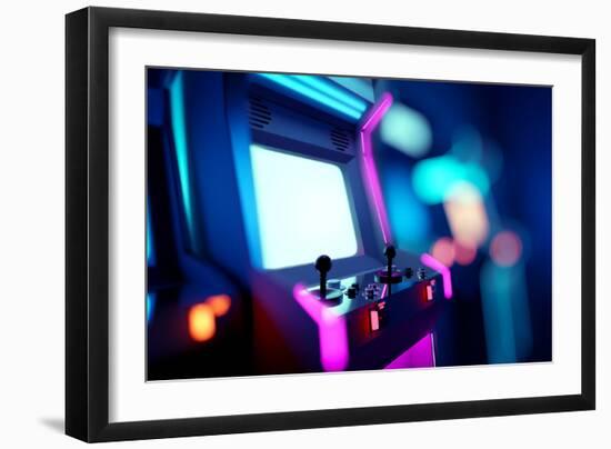 Neon Retro Arcade Machines In A Games Room-James Thew-Framed Art Print