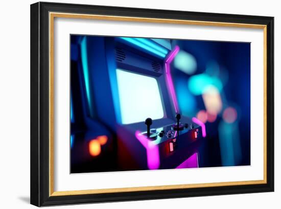 Neon Retro Arcade Machines In A Games Room-James Thew-Framed Art Print