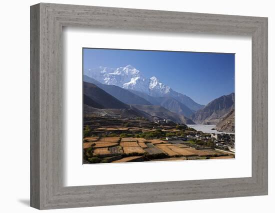 Nepal, Mustang, Kagbeni. the Soaring Peak of Nilgiri Behind the Village of Kagbeni.-Katie Garrod-Framed Photographic Print