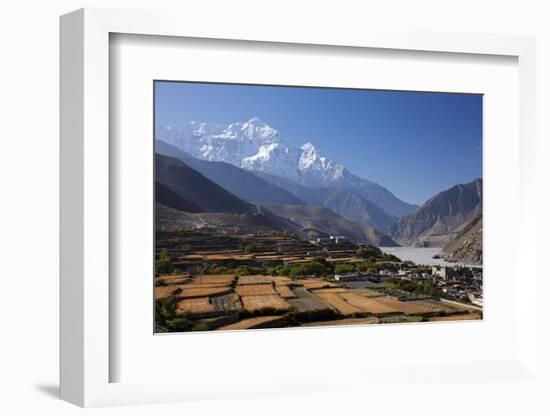 Nepal, Mustang, Kagbeni. the Soaring Peak of Nilgiri Behind the Village of Kagbeni.-Katie Garrod-Framed Photographic Print