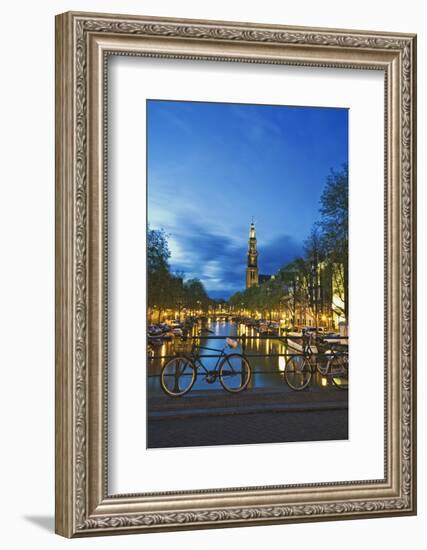 Netherlands, Amsterdam. Bikes on bridge over canal at sunset.-Jaynes Gallery-Framed Photographic Print