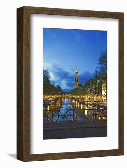 Netherlands, Amsterdam. Bikes on bridge over canal at sunset.-Jaynes Gallery-Framed Photographic Print