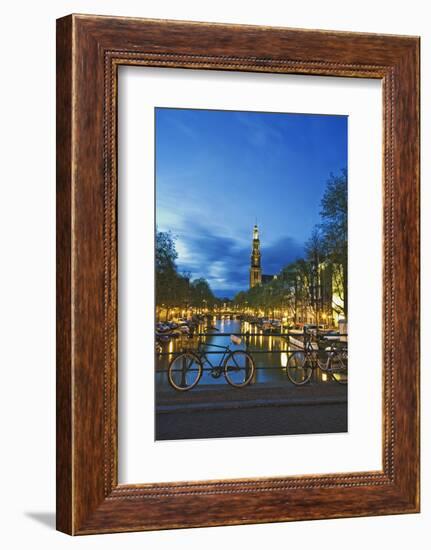 Netherlands, Amsterdam. Bikes on bridge over canal at sunset.-Jaynes Gallery-Framed Photographic Print