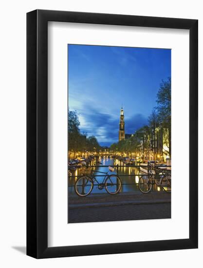Netherlands, Amsterdam. Bikes on bridge over canal at sunset.-Jaynes Gallery-Framed Photographic Print