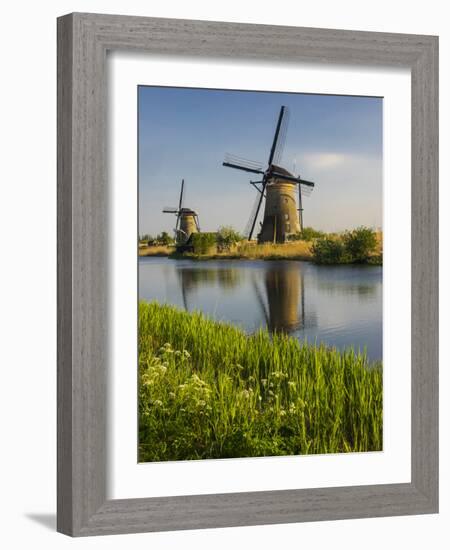 Netherlands, Kinderdijk, Windmills with evening light along the canals.-Terry Eggers-Framed Photographic Print