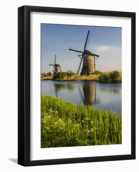 Netherlands, Kinderdijk, Windmills with evening light along the canals.-Terry Eggers-Framed Photographic Print