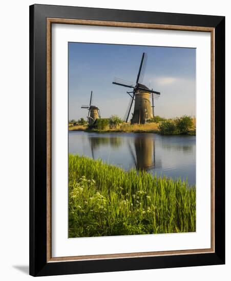 Netherlands, Kinderdijk, Windmills with evening light along the canals.-Terry Eggers-Framed Photographic Print