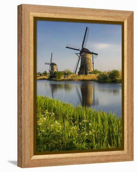 Netherlands, Kinderdijk, Windmills with evening light along the canals.-Terry Eggers-Framed Premier Image Canvas