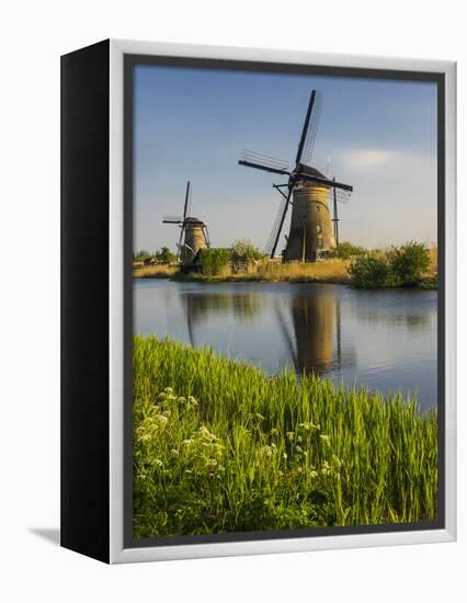Netherlands, Kinderdijk, Windmills with evening light along the canals.-Terry Eggers-Framed Premier Image Canvas