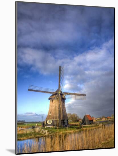 Netherlands, Nord Holland, Windmill along canal-Terry Eggers-Mounted Photographic Print