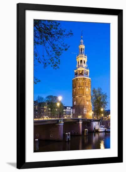 Netherlands, North Holland, Amsterdam. 16th century Montelbaanstoren tower on Oudeschans canal.-Jason Langley-Framed Photographic Print