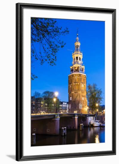 Netherlands, North Holland, Amsterdam. 16th century Montelbaanstoren tower on Oudeschans canal.-Jason Langley-Framed Photographic Print