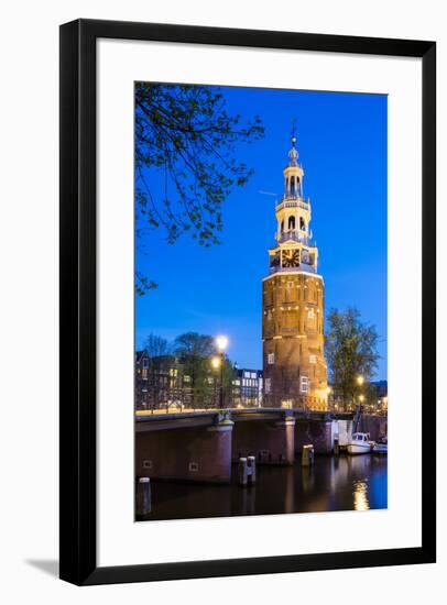 Netherlands, North Holland, Amsterdam. 16th century Montelbaanstoren tower on Oudeschans canal.-Jason Langley-Framed Photographic Print