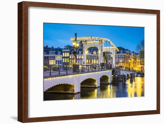 Netherlands, North Holland, Amsterdam. Magere Brug, Skinny Bridge, on the Amstel River at night.-Jason Langley-Framed Photographic Print