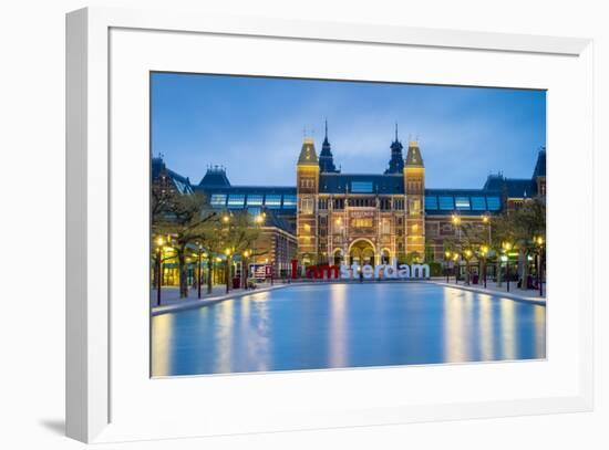 Netherlands, North Holland, Amsterdam. The Rijksmuseum on Museumplein at dusk.-Jason Langley-Framed Photographic Print