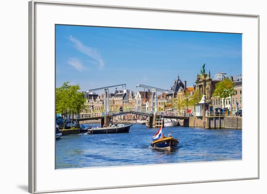 Netherlands, North Holland, Haarlem. A boat in front of the Gravestenenbrug drawbridge on the Spaar-Jason Langley-Framed Photographic Print