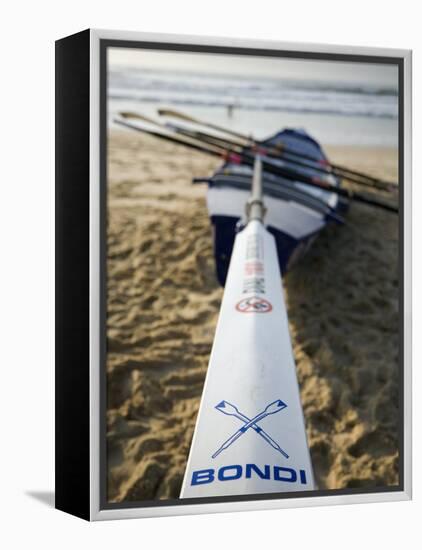 New South Wales, Sydney, A Surfboat Sits on Beach at Bondi in Sydney's Eastern Beaches, Australia-Andrew Watson-Framed Premier Image Canvas